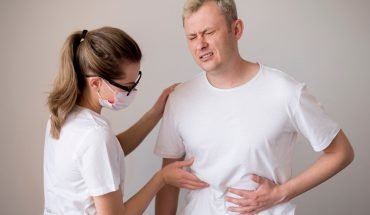 woman-wearing-mask-checking-man_23-2148506092